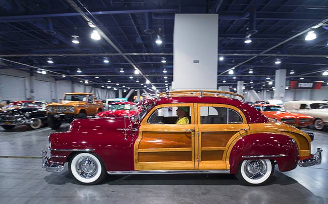 A 1947 Chrysler Town & Country sedan is pulled to the auction block during the second annual Mecum Auctions Las Vegas 2018 at the Las Vegas Convention Center Saturday, Nov. 17, 2018. The auction moved 1,000 vehicles across the auction block over three days.
