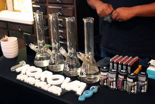 A glass bong station inside Harvest consumption lounge invited consumers of the plant to take a hit for $1. The bong station was set up as part of a special event on Monday, Nov. 19, 2018, during an NFL Monday Night Football watch party inside the lounge.