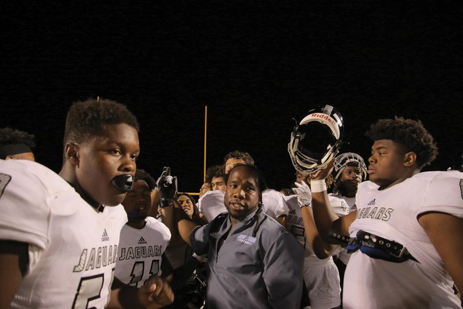 Desert Pines football coach David Hill addresses his players.