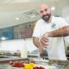 Ted Sumi rolls ice cream at one of his Las Vegas shops.