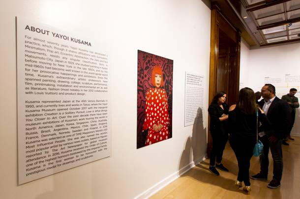 A biography of Yayoi Kusama is seen during a preview of two of her installation works, and infinity room titled 