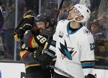 Vegas Golden Knights center Pierre-Edouard Bellemare, celebrates after left wing William Carrier (28) scored against the San Jose Sharks during the second period of an NHL hockey game Saturday, Nov. 24, 2018, in Las Vegas.