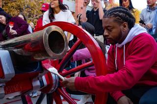 Rebel football player Malachi Miles paints the Fremont Cannon at UNLV, Monday, Nov. 26, 2018. The Rebels won the Fremont Cannon during a game against UNR on Saturday.