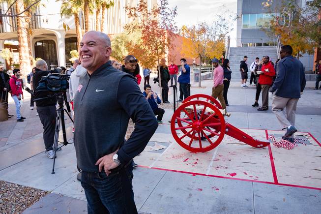 UNLV Head Coach Tony Sanchez smiles with the repainted Fremont Cannon behind him at UNLV, Monday, Nov. 26, 2018. The Rebels won the Fremont Cannon during a game against UNR on Saturday.