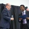 Michael Brown, left, president of Barrick U.S.A, awards a scholarship to Mubarek Hussen, of Desert Oasis High School, during the 62nd annual Las Vegas Sun Youth Forum at the Las Vegas Convention Center Thursday Nov. 29, 2018. The Clark County School District and Barrick Gold Corporation partnered with the Las Vegas Sun to put on the forum.