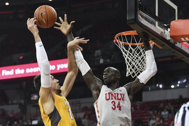 UNLV Rebels forward Cheikh Mbacke Diong (34) blocks a shot by Valparaiso Crusaders center Jaume Sorolla (14) during their game Wednesday, November 28, 2018, at the Thomas & Mack Center in Las Vegas.