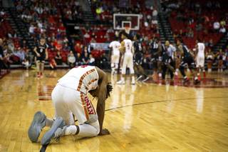 UNLV Rebels forward Joel Ntambwe (24) is slow to get up from the court after an injury in the final moments of a game against the Cincinnati Bearcats at the Thomas & Mack Center Saturday Dec. 1, 2018. The Bearcats beat the Rebels 65-61.