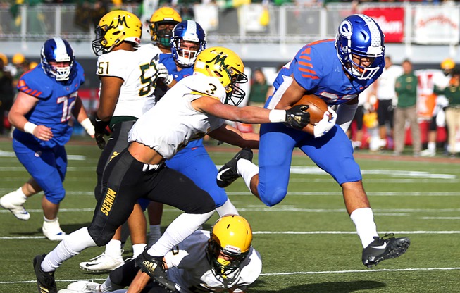 Bishop Gorman's running back Amod Cianelli (23) carries the ball ...