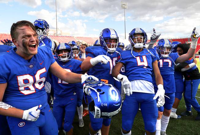 Bishop Gorman players celebrate after defeating  Bishop Manogue of Reno in the high school football state championship game at Sam Boyd Stadium Saturday, Dec. 1, 2018.