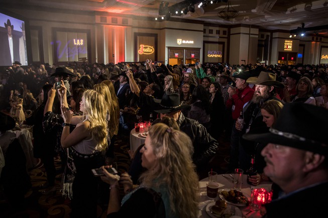 Guests enjoy the Professional Rodeo Cowboys Association's welcome reception on ...