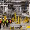 North Las Vegas City officials and media attend a tour of a new 855,000- square-foot Amazon customer fulfillment facility, in North Las Vegas Thursday, Dec. 6, 2018. This is Amazon's seventh fulfillment center in Nevada and will create over 1,000 full-time jobs when completed.