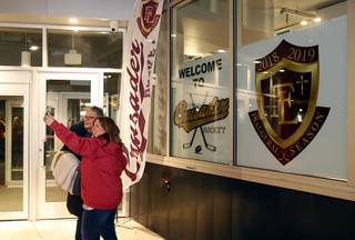 A pair of women stop for a selfie before Faith Lutheran's first home hockey game against the Utah High School Hockey club at City National Arena in Summerlin Dec. 14, 2018.
