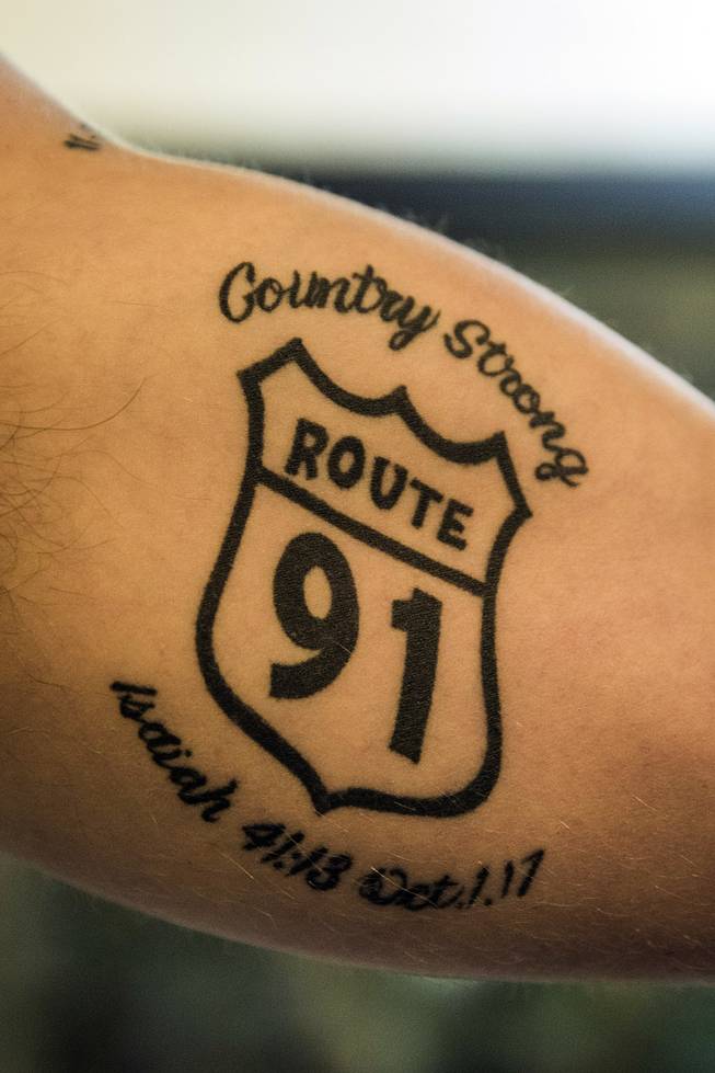 Brendan Kelly shows his tattoos that commemorate those lost in the two mass shootings he endured, in Thousand Oaks, Calif., Dec. 20, 2018. After witnessing carnage and surviving both the Thousand Oaks and Las Vegas mass shootings, Kelly will soon be on his first tour of duty as a Marine.