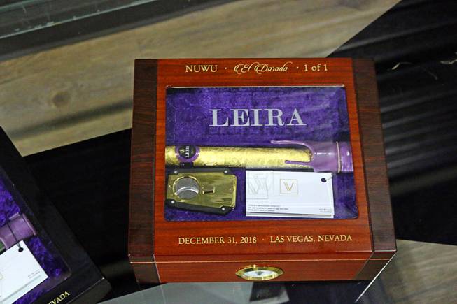 A cannabis cigar produced by Las Vegas cultivator Virtue and production company Leira rests in a wood grain case at Nuwu Cannabis Marketplace on Friday, Dec. 28, 2018. The 24-gram cannagar, wrapped in hemp and 24-karat gold leaf, was sold to Los Angeles resident Brandon Hawkins for $11,000. 