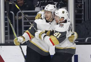 Vegas Golden Knights' William Karlsson, left, celebrates his goal with teammate Jonathan Marchessault during the third period of an NHL hockey game against the Los Angeles Kings on Saturday, Dec. 29, 2018, in Los Angeles. 