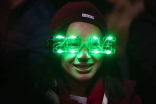 A reveler wears light up glasses during a New Year's Eve celebration on The Strip, Monday, Dec. 31, 2018.