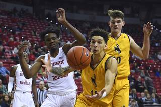 Wyoming Cowboys forward Trace Young (11) corrals a rebound against the UNLV Rebels during their Mountain West Conference basketball game Saturday, January 5, 2019, at the Thomas & Mack Center.