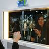 A woman demonstrates the Artemis smart mirror at the CareOS booth during CES Unveiled at CES International, Sunday, Jan. 6, 2019, in Las Vegas. The interactive mirror has video capture, virtual try-ons, facial and object recognition, and can give the user video instruction on specific makeup products, among other things.