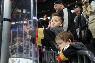 Hockey fans watch as the Vegas Golden Knights warm-up on the ice before their game against the New York Rangers, Tues. Jan 8, 2018.