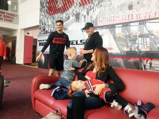 The Sassman family — parents Eric and Marie, 6-year-old Evan and 2-year-old Fiona — meet Jay Green, left, a guard for the UNLV men's basketball team, on Jan. 6 at a community event sponsored Nevada Hands and Voices.