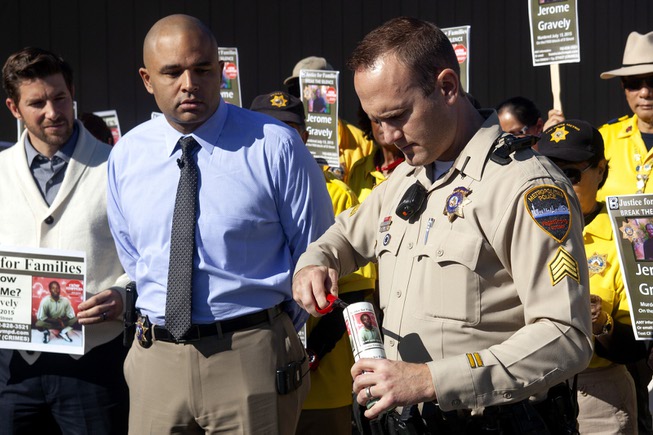 Las Vegas Metro Police Sergeant Joshua Stark lights a candle ...