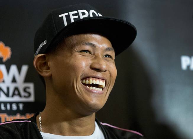Featherweight boxer Jhack Tepora of the Philippines smiles in the MGM Grand lobby in Las Vegas Tuesday, Jan 15, 2019. Tepora will face Hugo Ruiz of Mexico for an interim WBA featherweight title at the MGM Grand Garden Arena on Saturday.