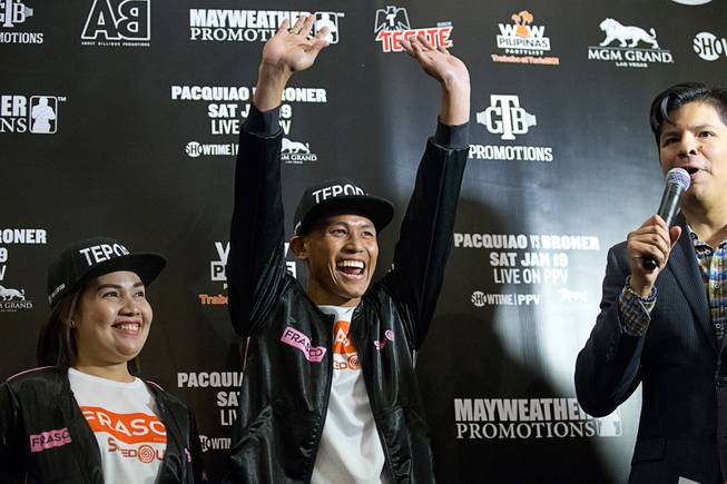 Featherweight boxer Jhack Tepora, center, of the Philippines waves to fans during an interview in the MGM Grand lobby in Las Vegas Tuesday, Jan 15, 2019. Tepora will face Hugo Ruiz of Mexico for an interim WBA featherweight title at the MGM Grand Garden Arena on Saturday.