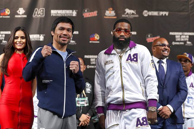 WBA welterweight champion Manny Pacquiao, left, of the Philippines and  Adrien Broner of Cincinnati, Ohio pose during a news conference at the MGM Grand Wednesday, Jan. 16, 2019. Pacquiao will defend his WBA title against Broner at the MGM Grand Garden Arena Saturday.