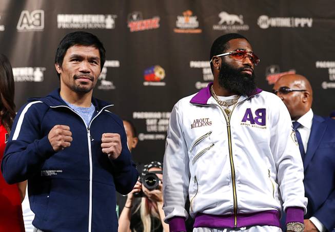 WBA welterweight champion Manny Pacquiao, left, of the Philippines and  Adrien Broner of Cincinnati, Ohio pose during a news conference at the MGM Grand Wednesday, Jan. 16, 2019. Pacquiao will defend his WBA title against Broner at the MGM Grand Garden Arena Saturday.