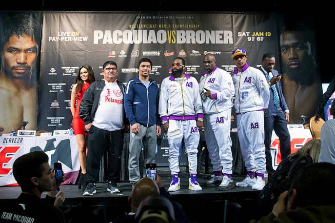 WBA welterweight champion Manny Pacquiao, center left, and challenger Adrien Broner pose with trainers during a news conference at the MGM Grand Wednesday, Jan. 16, 2019. Pacquiao will defend his WBA title against Adrien Broner at the MGM Grand Garden Arena Saturday.