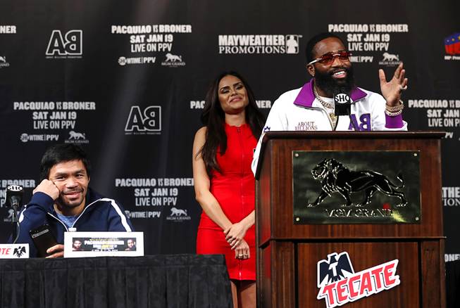 WBA welterweight champion Manny Pacquiao, left, of the Philippines, listens to challenger Adrien Broner of Cincinnati, Ohio during a news conference at the MGM Grand Wednesday, Jan. 16, 2019. Pacquiao will defend his WBA title against Broner at the MGM Grand Garden Arena Saturday.