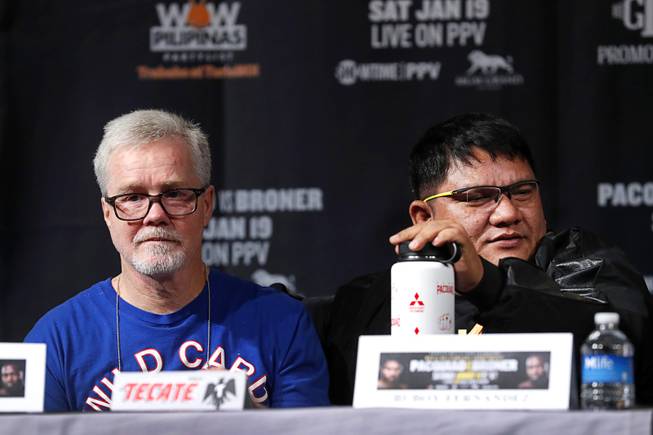 Manny Pacquiao's co-trainers Freddie Roach and Buboy Fernandez wait for the start of a news conference at the MGM Grand Wednesday, Jan. 16, 2019. Pacquiao will defend his WBA title against Adrien Broner of Cincinnati, Ohio at the MGM Grand Garden Arena Saturday.