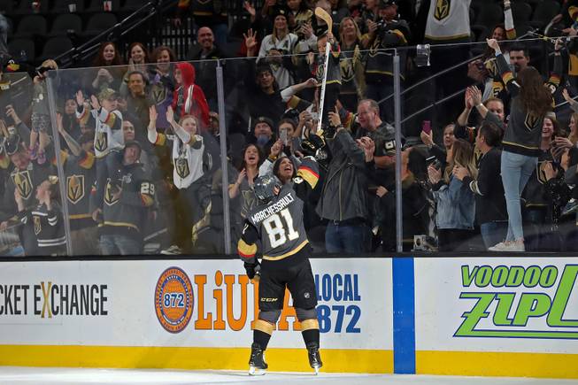 Vegas Golden Knights center Jonathan Marchessault (81) hands a game stick to a young fan after his team defeats the Pittsburgh Penguins, 7-3, during an NHL hockey game at T-Mobile arena Saturday, Jan. 19, 2019.
