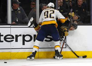 Vegas Golden Knights left wing Max Pacioretty (67) is upended by Nashville Predators center Ryan Johansen (92) during a game at T-Mobile Arena Wednesday, Jan. 23, 2019.