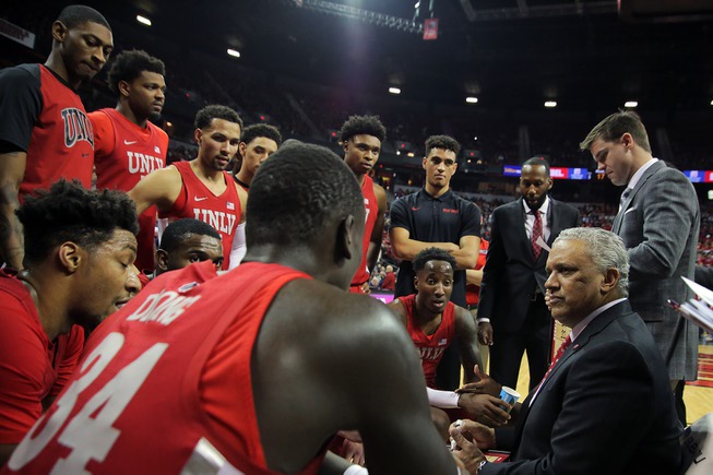 UNLV head coach Marvin Menzies talks with his teams during ...