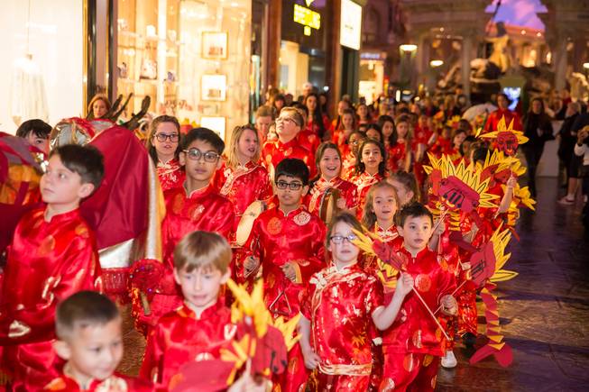 Students from The Meadows School perform a traditional dragon parade through the Forum Shops at Caesars Palace in celebration of Chinese New Year and the Year of the Pig, Tuesday Feb. 5, 2019.