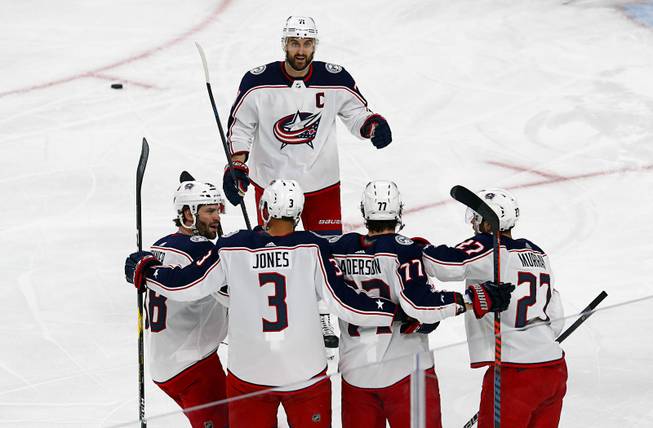 Columbus Blue Jackets left wing Nick Foligno (71) celebrates with teammates after scoring against the Vegas Golden Knights during the first period at T-Mobile Arena Saturday, Feb. 9, 2018.