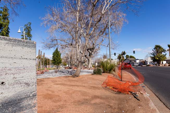A fallen construction fence surrounds Huntridge Circle Park Wednesday, Feb. 6, 2019.