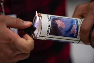 A candle is lit during a Justice for Families press conference for the unsolved murder of Celia Luna-Delgado Thursday, Feb. 14, 2019. Luna-Delgado was killed during a robbery by two suspects who have still not been apprehended. Anyone with tips can call (702) 828-3521, email homicide@lvmpd.com or text CRIMENV along with tip to 274637 (CRIMES).
