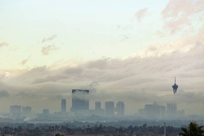 The Stratosphere is shrouded in low hanging clouds following rainstorms that caused flash flooding and numerous traffic incidents Thursday, Feb. 14, 2019.