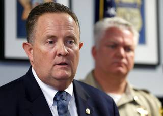 Daniel W. Neill, assistant special agent in charge for the Drug Enforcement Administration in Las Vegas, responds to a question during a news conference at the DEA office in Las Vegas Thursday, Feb. 21, 2019. Metro Police Deputy Chief Christopher Darcy is at right. Officials discussed Operation Hypocritical Oath, an initiative targeting physicians who illegally prescribe controlled substances.