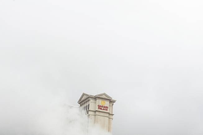 Caesars Palace is engulf by fog during snowy weather Thursday Feb. 21, 2019.