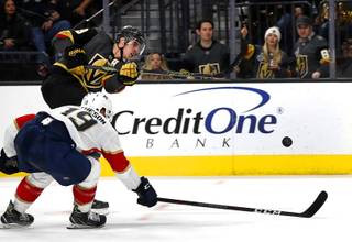 Vegas Golden Knights right wing Reilly Smith (19) scores past Florida Panthers defenseman Mike Matheson (19) during the third period at T-Mobile Arena Thursday, Feb. 28, 2019.