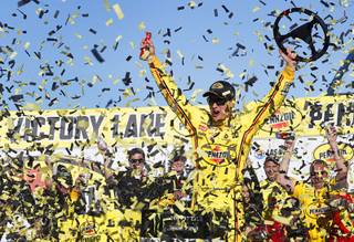 Joey Logano celebrates in Victory Lane after winning the Pennzoil 400 NASCAR cup race at the Las Vegas Motor Speedway Sunday, March 3, 2019.