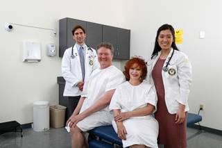 Actor-patients and medical students pose for a photo in an exam room at Touro University Nevada in Henderson Friday, Feb. 1, 2019. From left: Daniel DeMers, Kerstan Szczerpansk, Beverly Washburn, Michelle Baek.