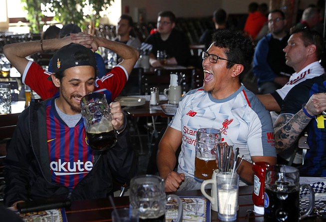 FC Liverpool fan Dennis Chinchilla, right, celebrates a goal during ...