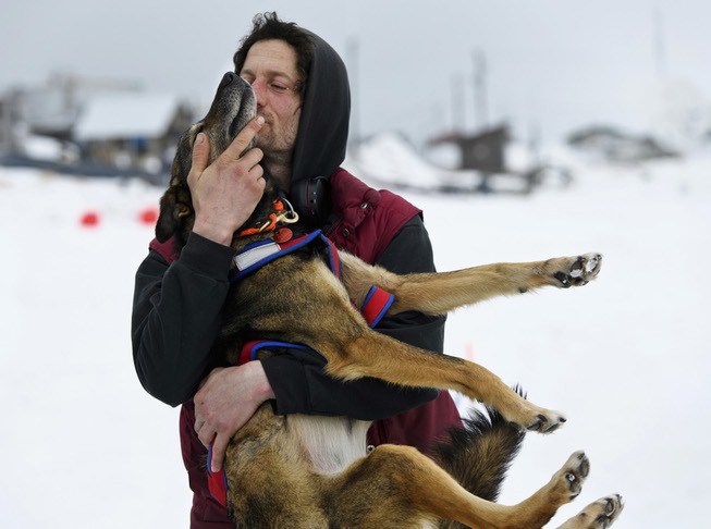 Nicolas Petit hugs one of his dogs before they leave ...