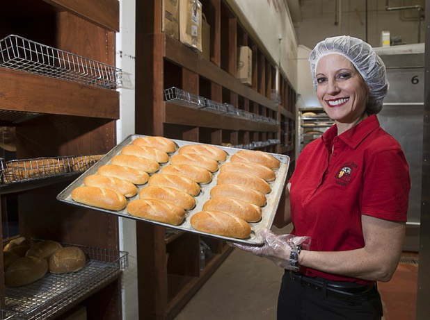 Deborah Morelli holds a tray of steak rolls at Great Buns Bakery, 3270 E. Tropicana Ave., Thursday, March 14, 2019. The family-owned bakery has been operating in Las Vegas since 1982.