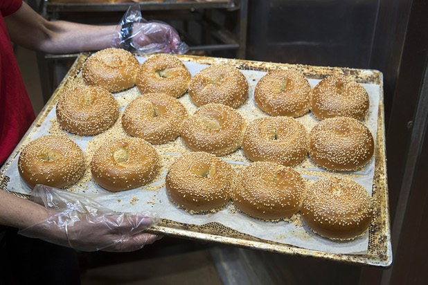 Deborah Morelli holds a tray of sesame seed bagels at Great Buns Bakery, 3270 E. Tropicana Ave., Thursday, March 14, 2019. The family-owned bakery has been operating in Las Vegas since 1982.