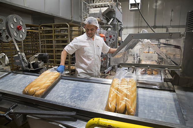 Supervisor Denis Martinez works on a packaging line at Great Buns Bakery, 3270 E. Tropicana Ave., Thursday, March 14, 2019. The family-owned bakery has been operating in Las Vegas since 1982.